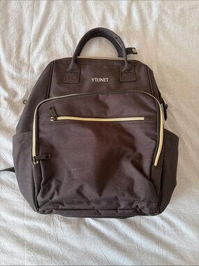 Black Backpack with Gold Zipper Accents